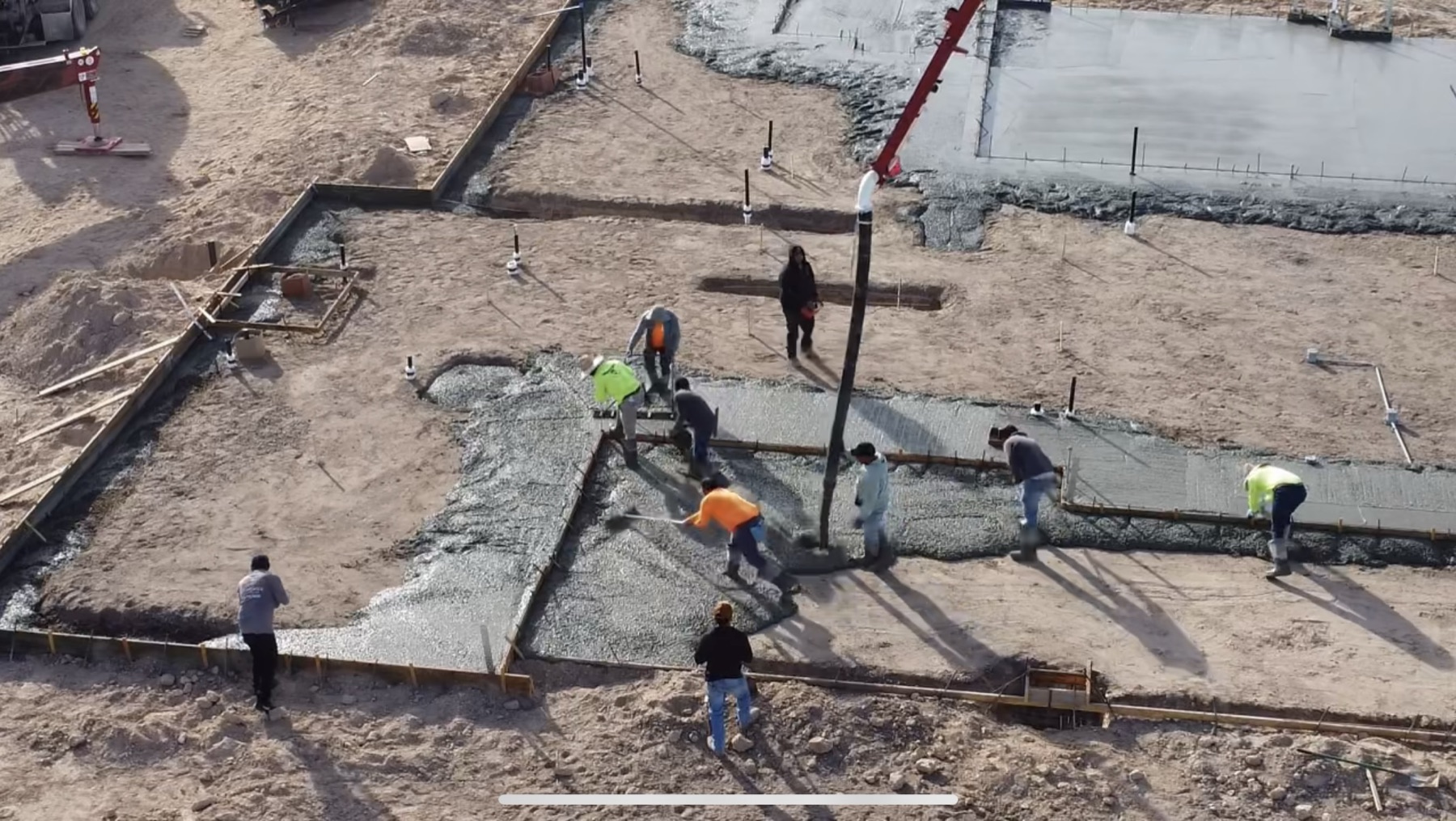 Crew pouring with concrete pump