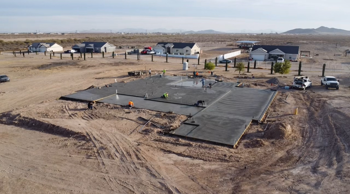 Aerial — large foundation pour with full crew