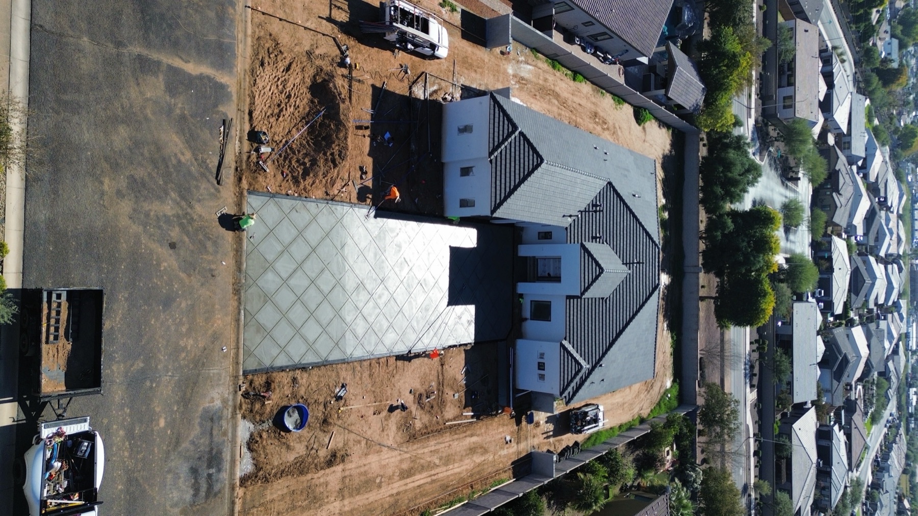 Aerial view of sidewalk pour with long evening shadows