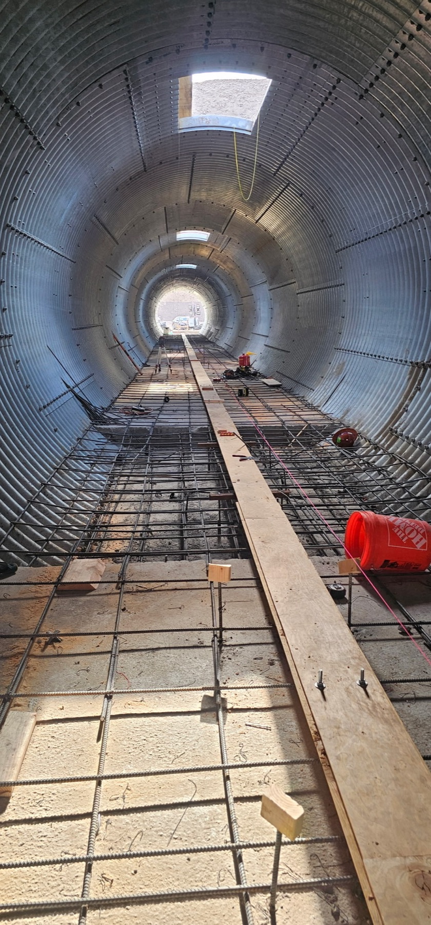 Rebar work inside a drainage culvert