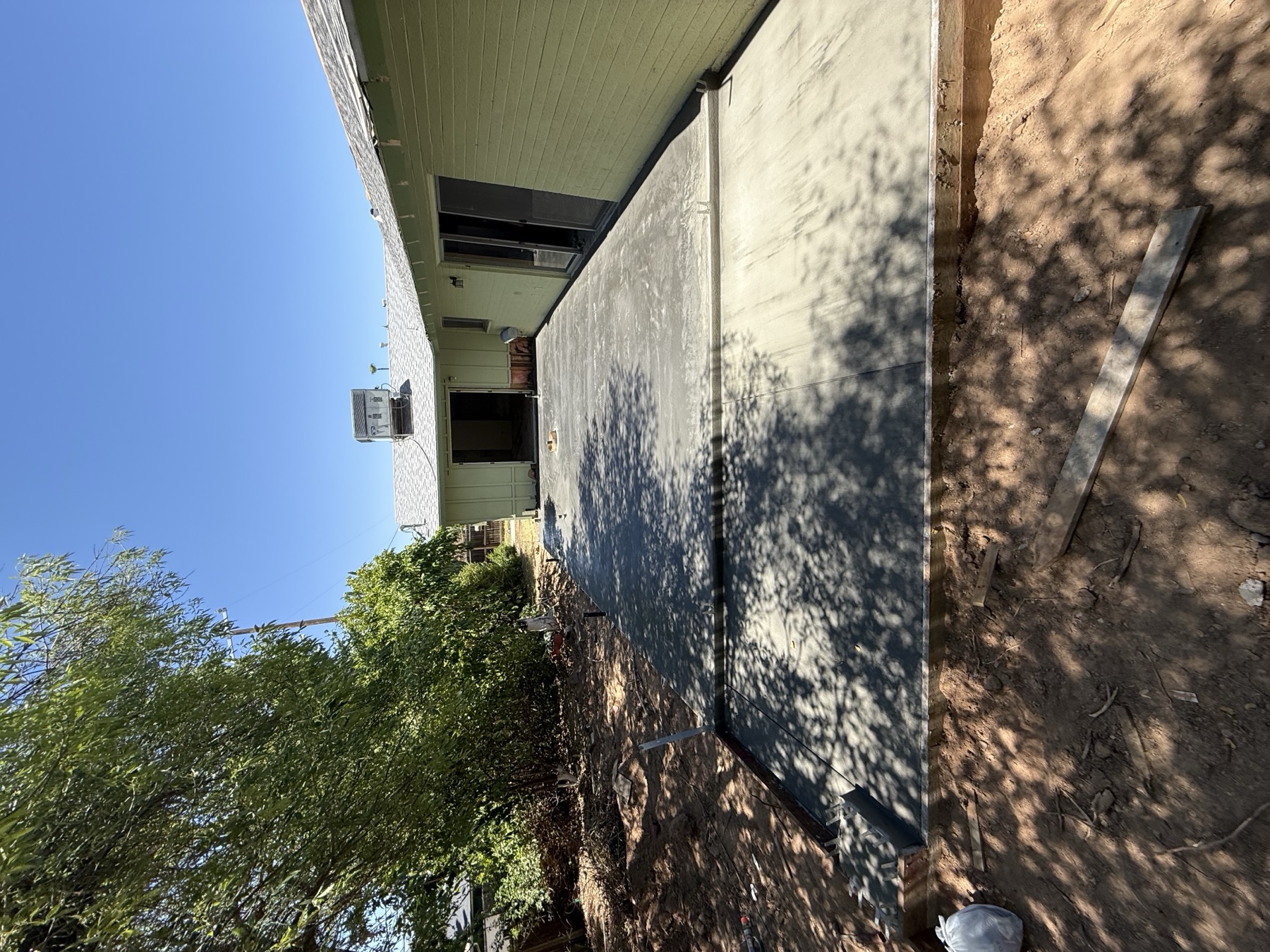 Foundation extension pour under tree shade