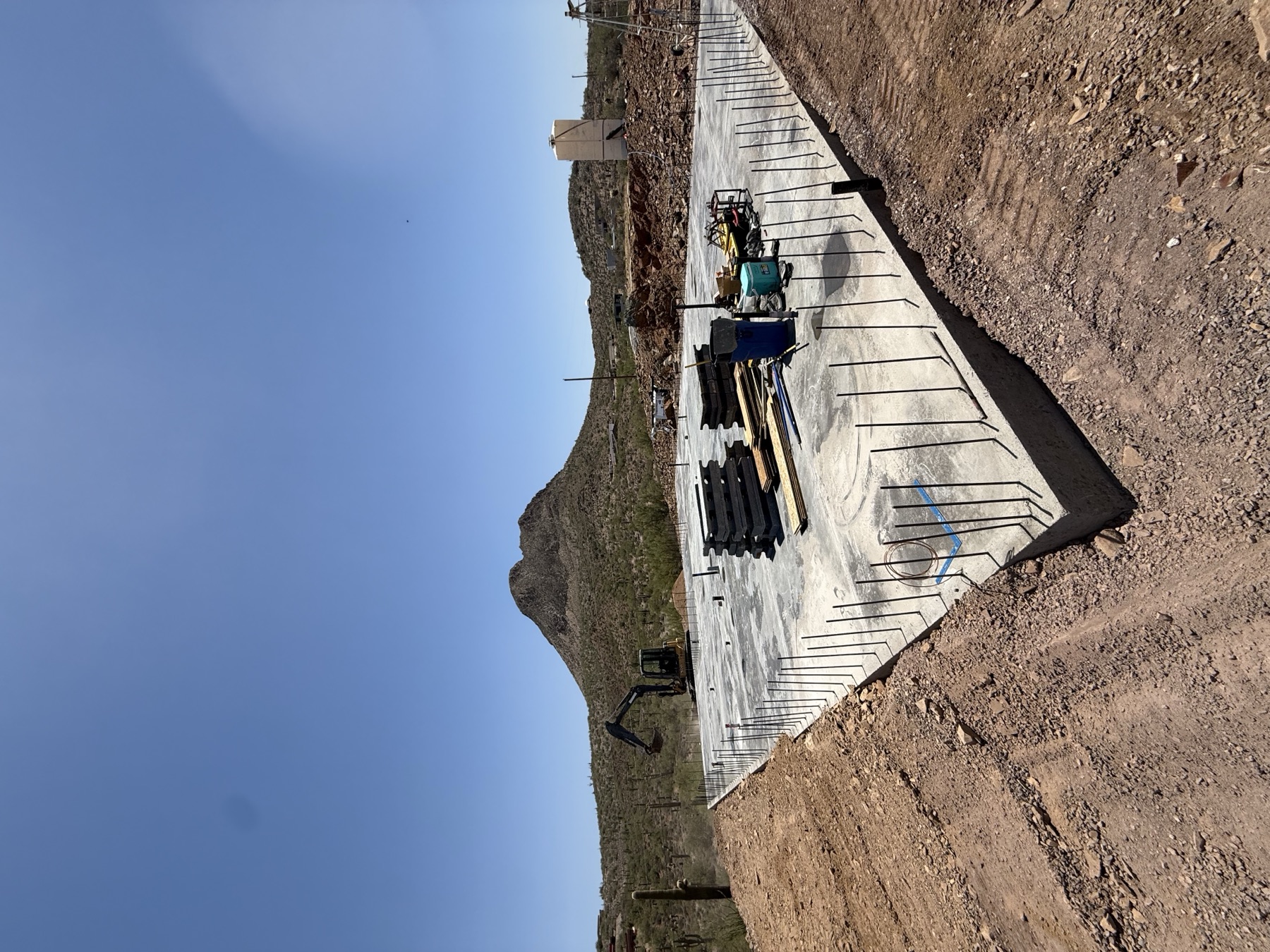 Rebar foundation prep with mountain backdrop